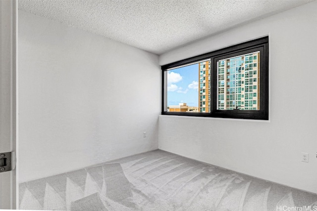 615 Keawe St Unit 406, Honolulu, HI 96813 - unfurnished room featuring a textured ceiling and carpet floors