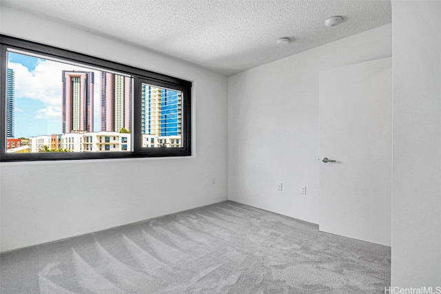 615 Keawe St Unit 406, Honolulu, HI 96813 - carpeted spare room with a textured ceiling and a wealth of natural light