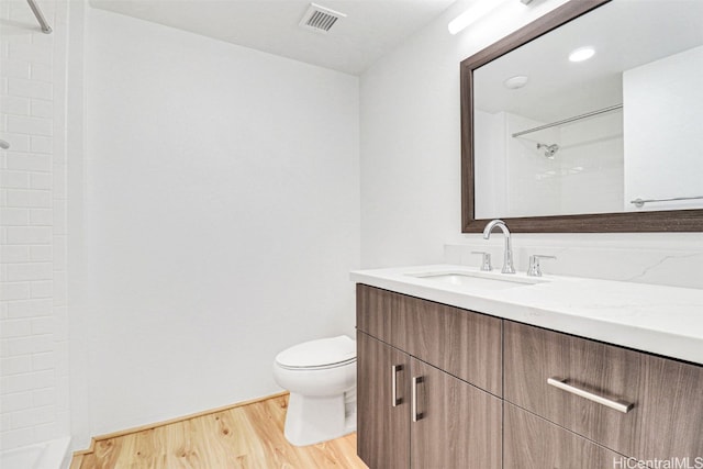 615 Keawe St Unit 406, Honolulu, HI 96813 - bathroom with toilet, wood-type flooring, vanity, and walk in shower