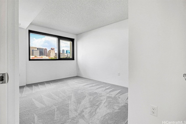 615 Keawe St Unit 406, Honolulu, HI 96813 - carpeted empty room with a textured ceiling