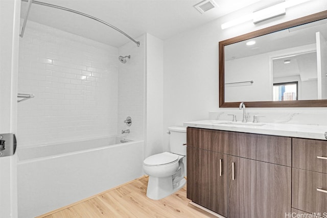 615 Keawe St Unit 406, Honolulu, HI 96813 - full bathroom with toilet, vanity, hardwood / wood-style flooring, and tiled shower / bath