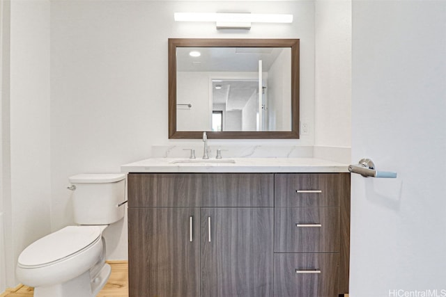 615 Keawe St Unit 406, Honolulu, HI 96813 - bathroom featuring toilet, hardwood / wood-style floors, and vanity