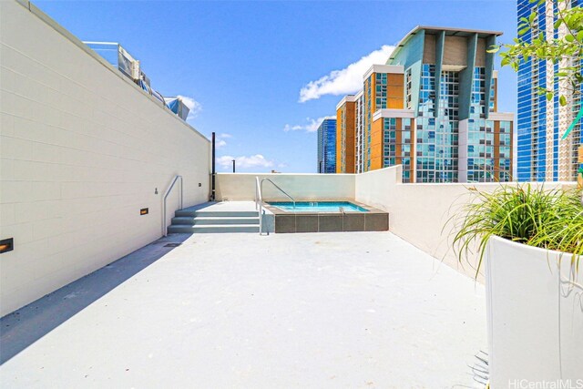 615 Keawe St Unit 406, Honolulu, HI 96813 - view of patio / terrace featuring a hot tub