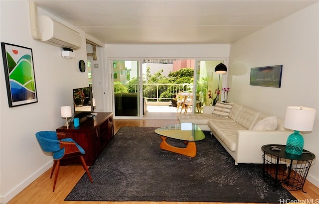 living room with wood-type flooring and a wall unit AC