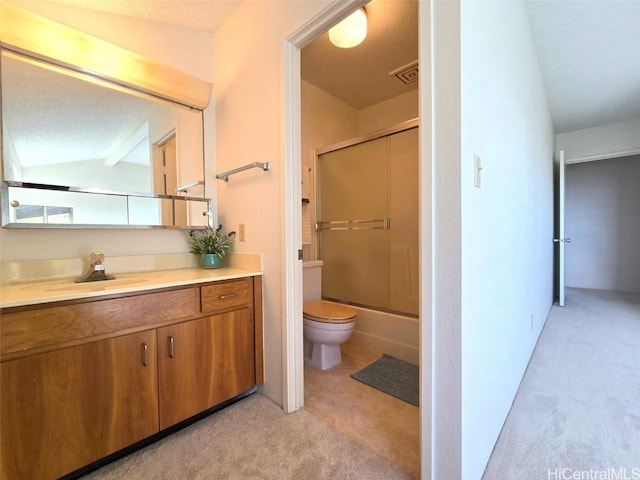 full bathroom featuring vaulted ceiling, a textured ceiling, enclosed tub / shower combo, and vanity