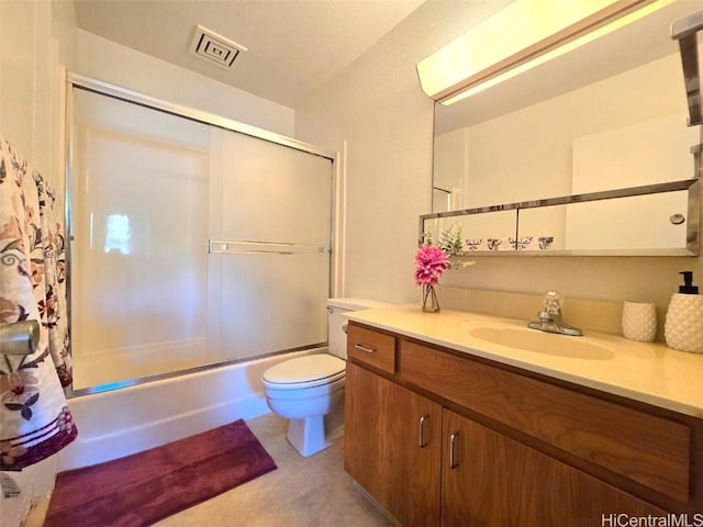 full bathroom with toilet, vanity, and shower / bath combination with glass door