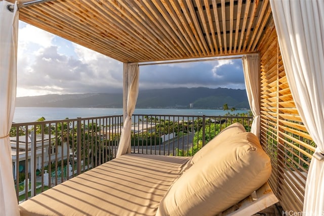 balcony featuring a water view