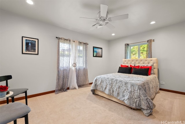 bedroom with light colored carpet and ceiling fan