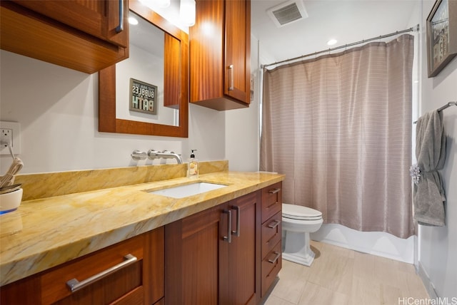 full bathroom with vanity, toilet, and shower / tub combo