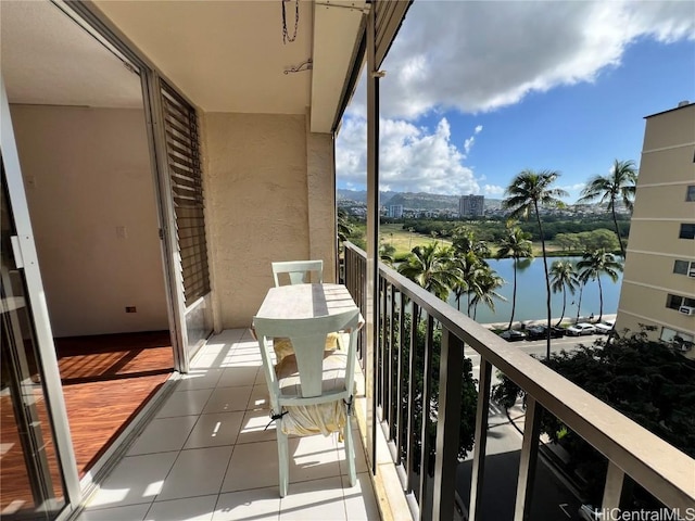 balcony featuring a water view