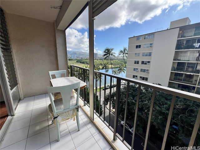 balcony featuring a water view