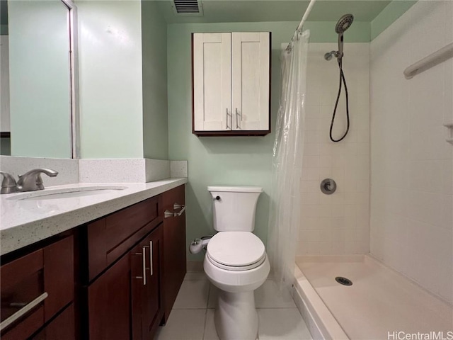 bathroom with a shower with curtain, tile patterned floors, toilet, and vanity