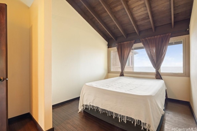 bedroom featuring lofted ceiling with beams, wooden ceiling, and dark wood-type flooring