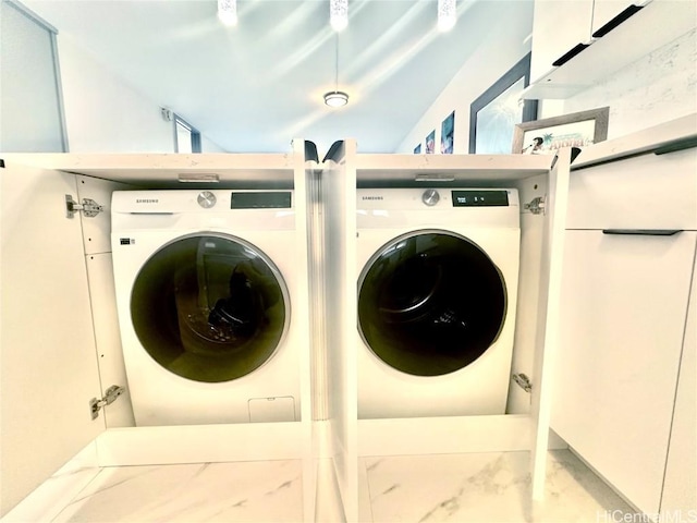 washroom with washer and dryer