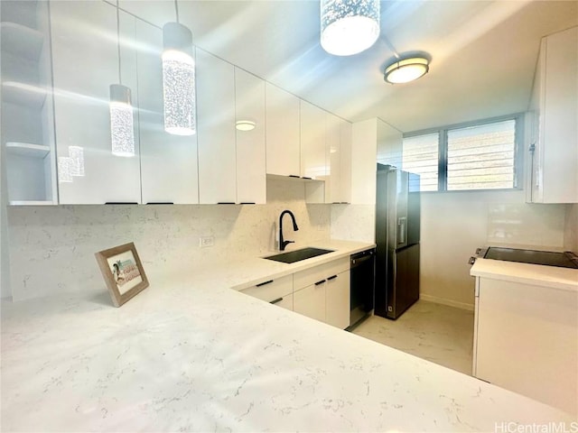 kitchen with sink, decorative light fixtures, stainless steel fridge with ice dispenser, black dishwasher, and white cabinetry