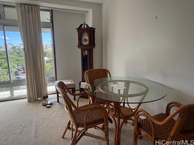 dining space with carpet and a healthy amount of sunlight