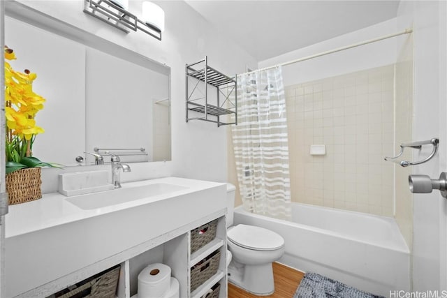 full bathroom with shower / tub combo with curtain, vanity, wood-type flooring, and toilet