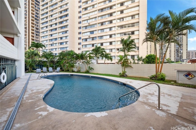 view of swimming pool featuring a patio