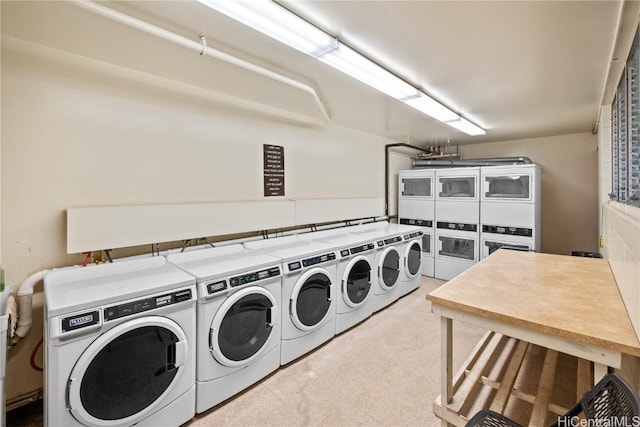 washroom featuring washing machine and dryer and stacked washer / drying machine