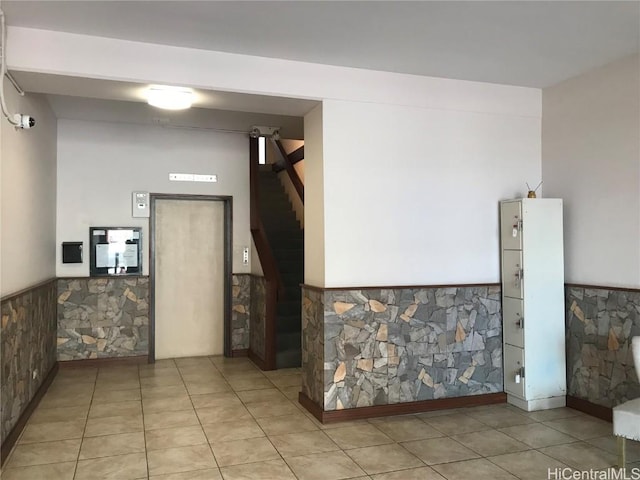 interior space featuring light tile patterned floors