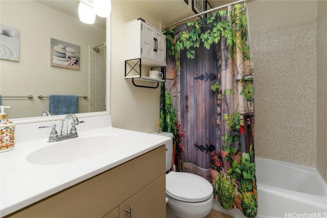 full bathroom featuring shower / tub combo, vanity, and toilet