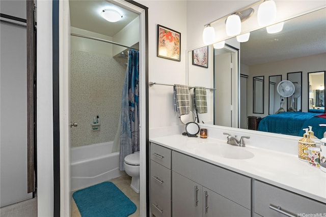 full bath with tile patterned flooring, vanity, toilet, connected bathroom, and shower / tub combo with curtain