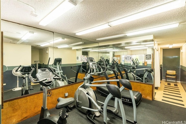 workout area featuring a textured ceiling