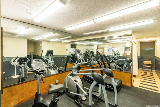 exercise room with a textured ceiling