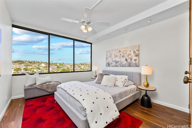 bedroom featuring ceiling fan and dark hardwood / wood-style flooring