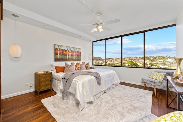 bedroom featuring dark hardwood / wood-style flooring and ceiling fan