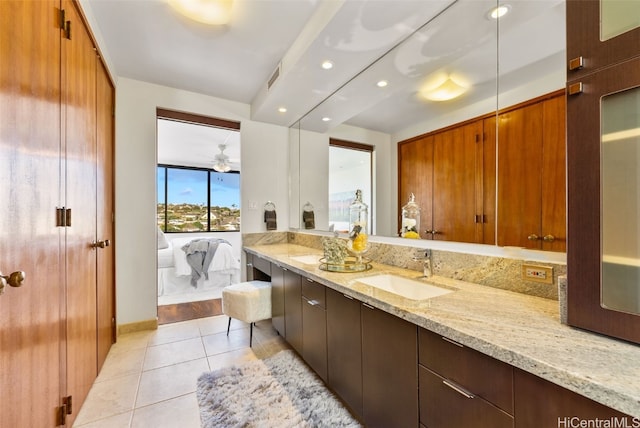 bathroom featuring ceiling fan, tile patterned flooring, and vanity