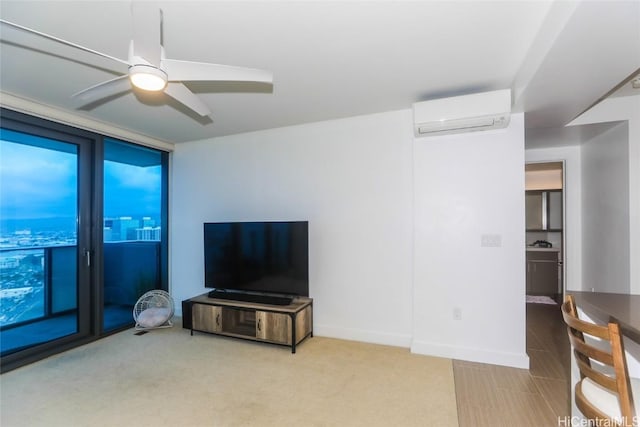 living room featuring an AC wall unit, ceiling fan, and a wall of windows