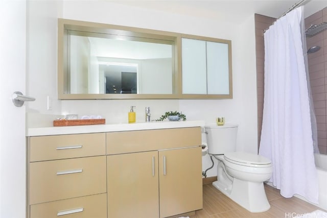 full bathroom with vanity, toilet, and shower / bath combo with shower curtain