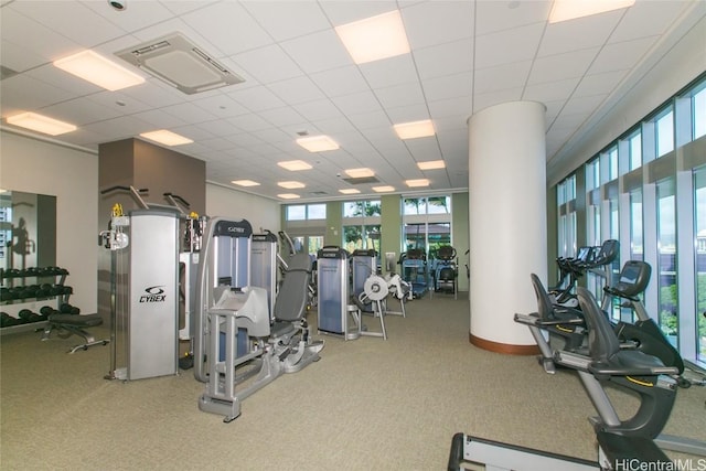 gym featuring a paneled ceiling