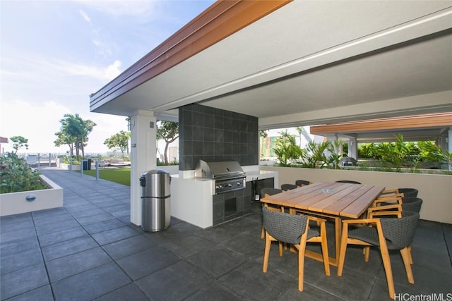 view of patio featuring area for grilling and exterior kitchen