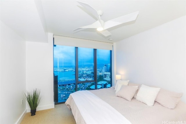 carpeted bedroom featuring ceiling fan and access to outside