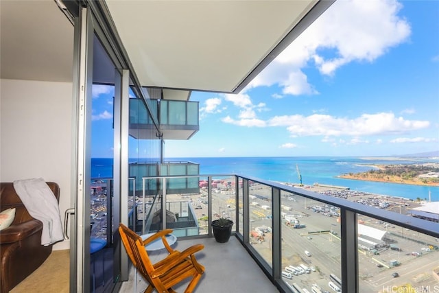 balcony featuring a water view