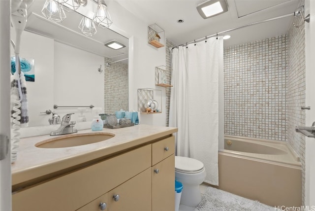 full bathroom with shower / bath combo with shower curtain, vanity, and toilet