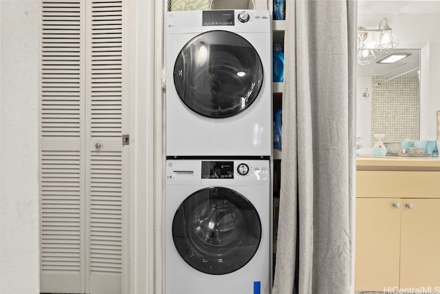 laundry room with stacked washer and clothes dryer