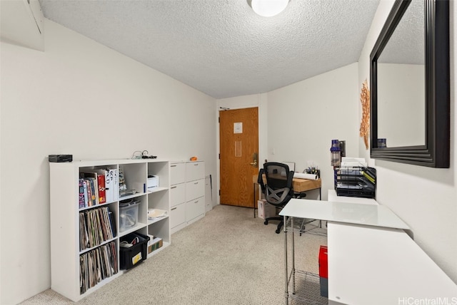 office area featuring light colored carpet and a textured ceiling