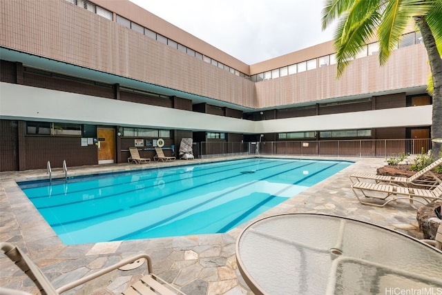 view of swimming pool with a patio