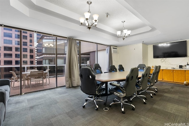 home office featuring a raised ceiling, carpet floors, a textured ceiling, and a chandelier