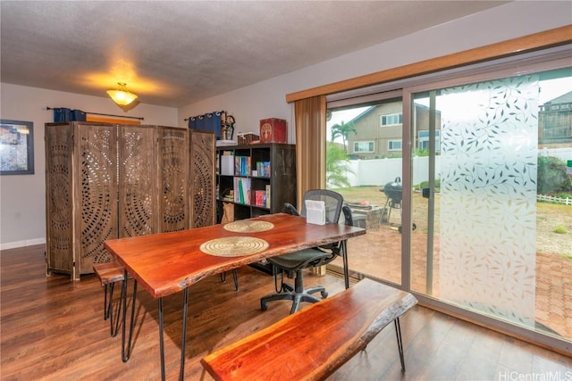 dining area with hardwood / wood-style floors