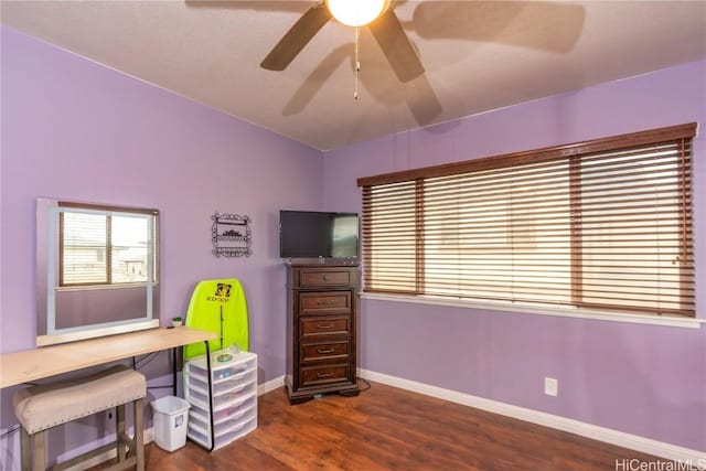 office space with ceiling fan and dark wood-type flooring