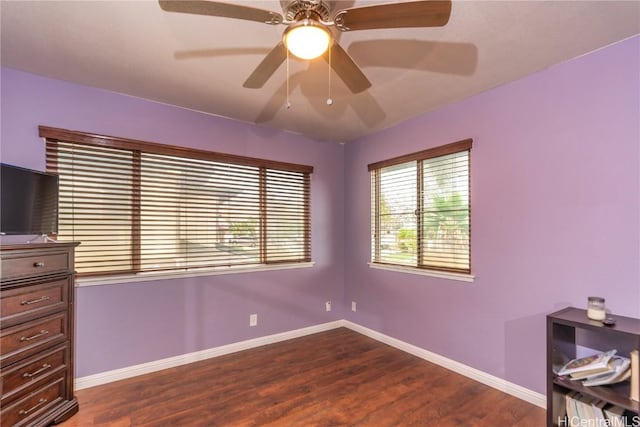 bedroom with ceiling fan and dark hardwood / wood-style flooring