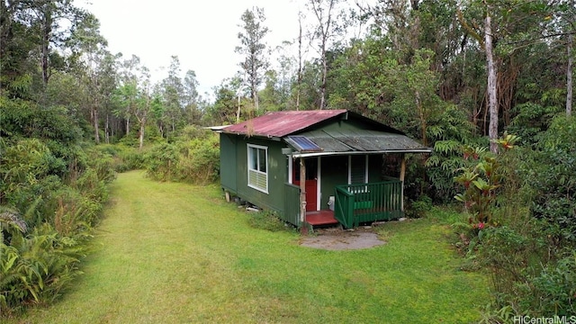 view of outbuilding with a yard