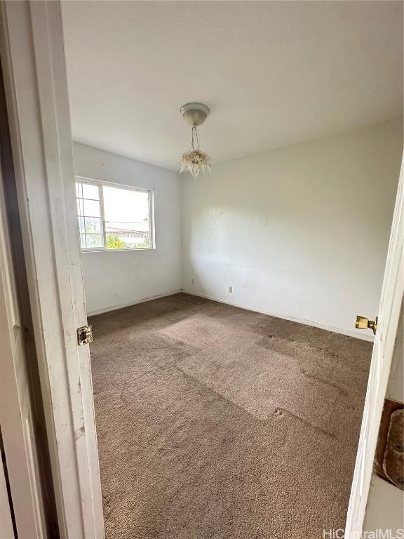 unfurnished room with carpet floors