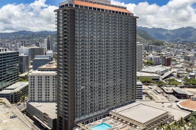 property's view of city featuring a mountain view