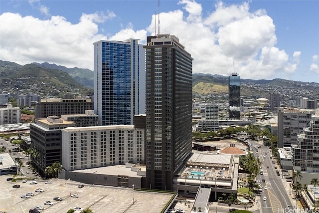 property's view of city featuring a mountain view