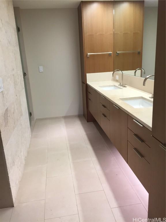 bathroom featuring tile patterned floors and vanity